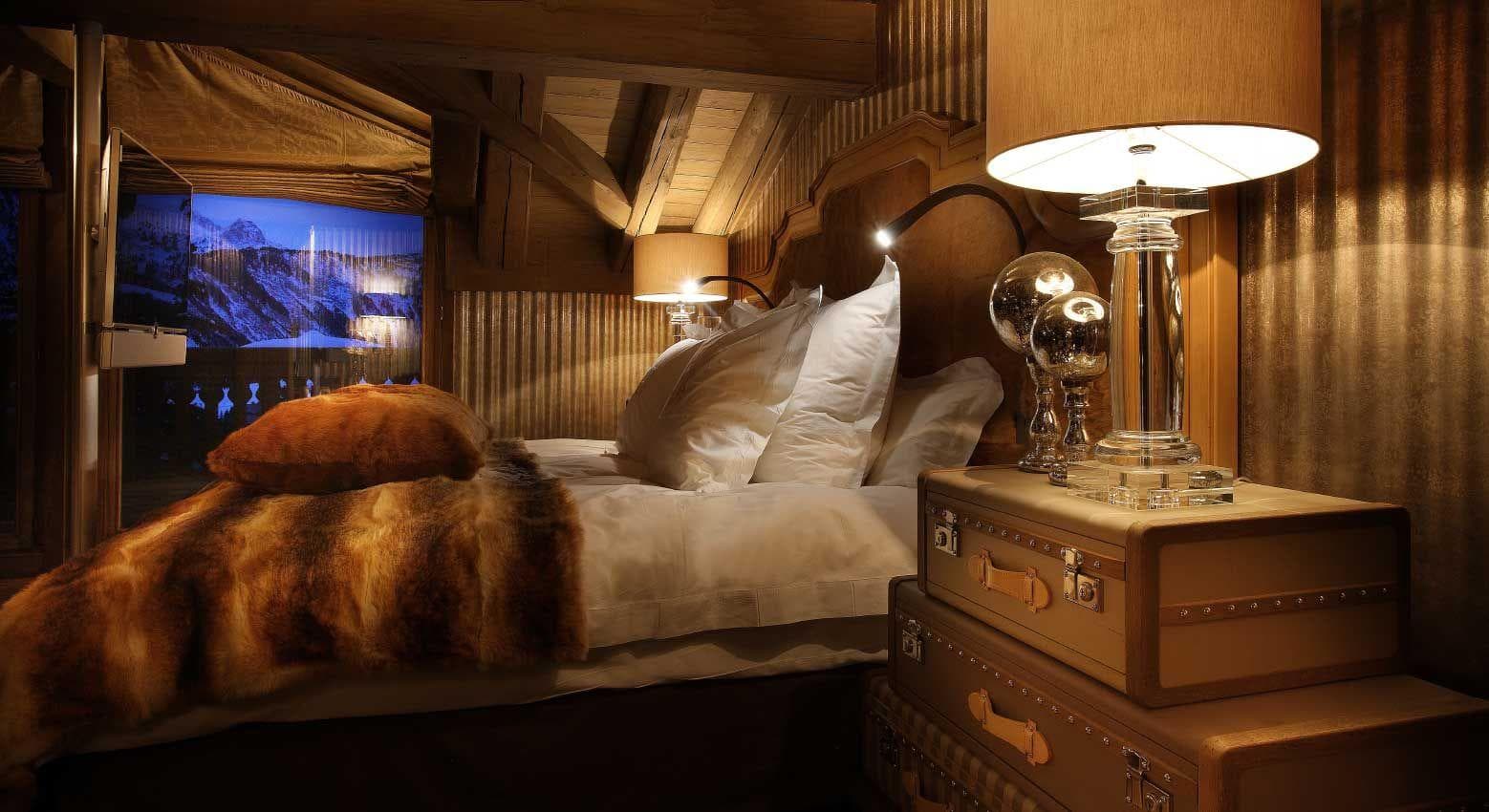 Bedroom with exposed timber beams and mountain views