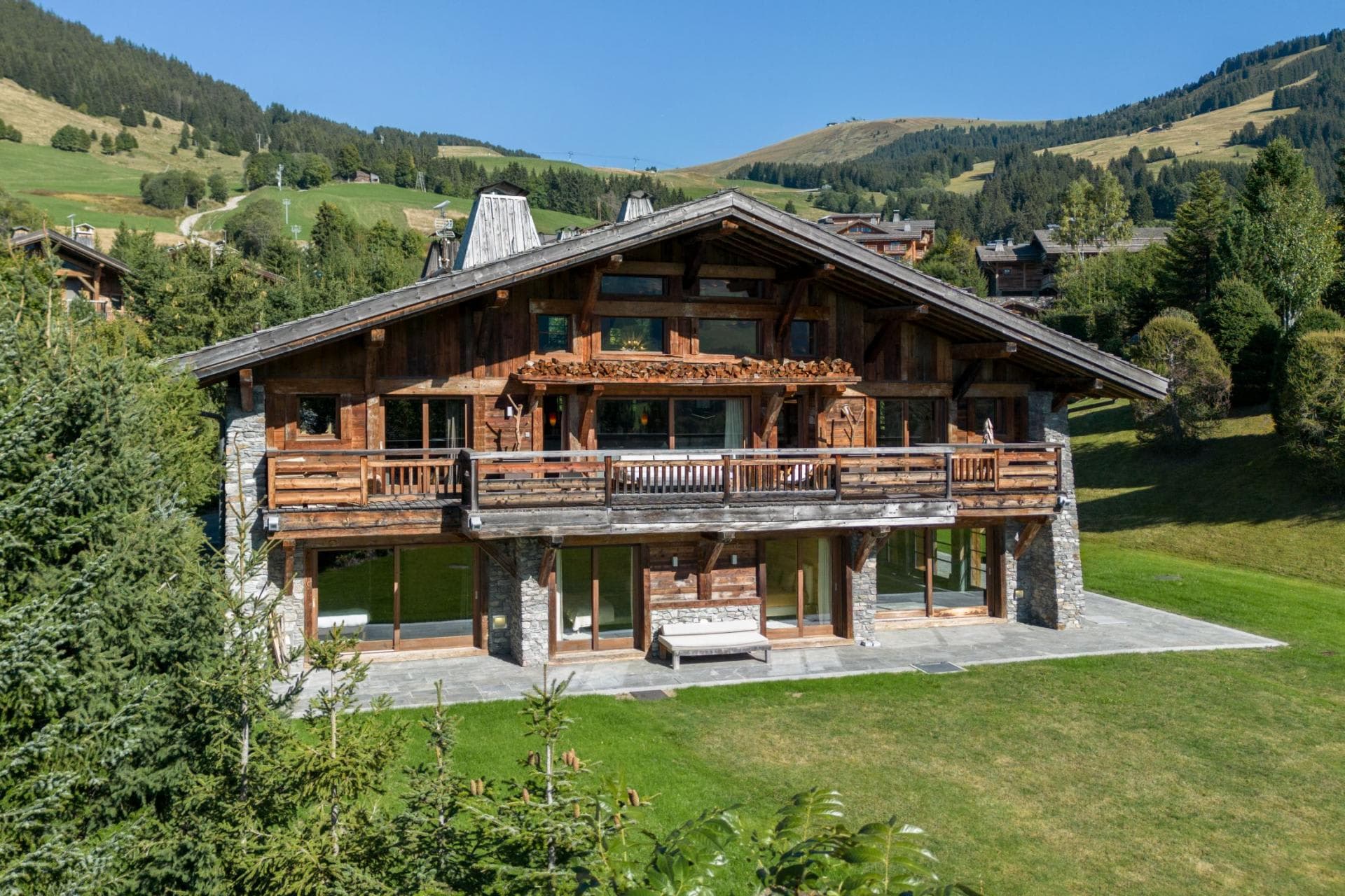 Chalet exterior with wrap-around balcony and direct garden access