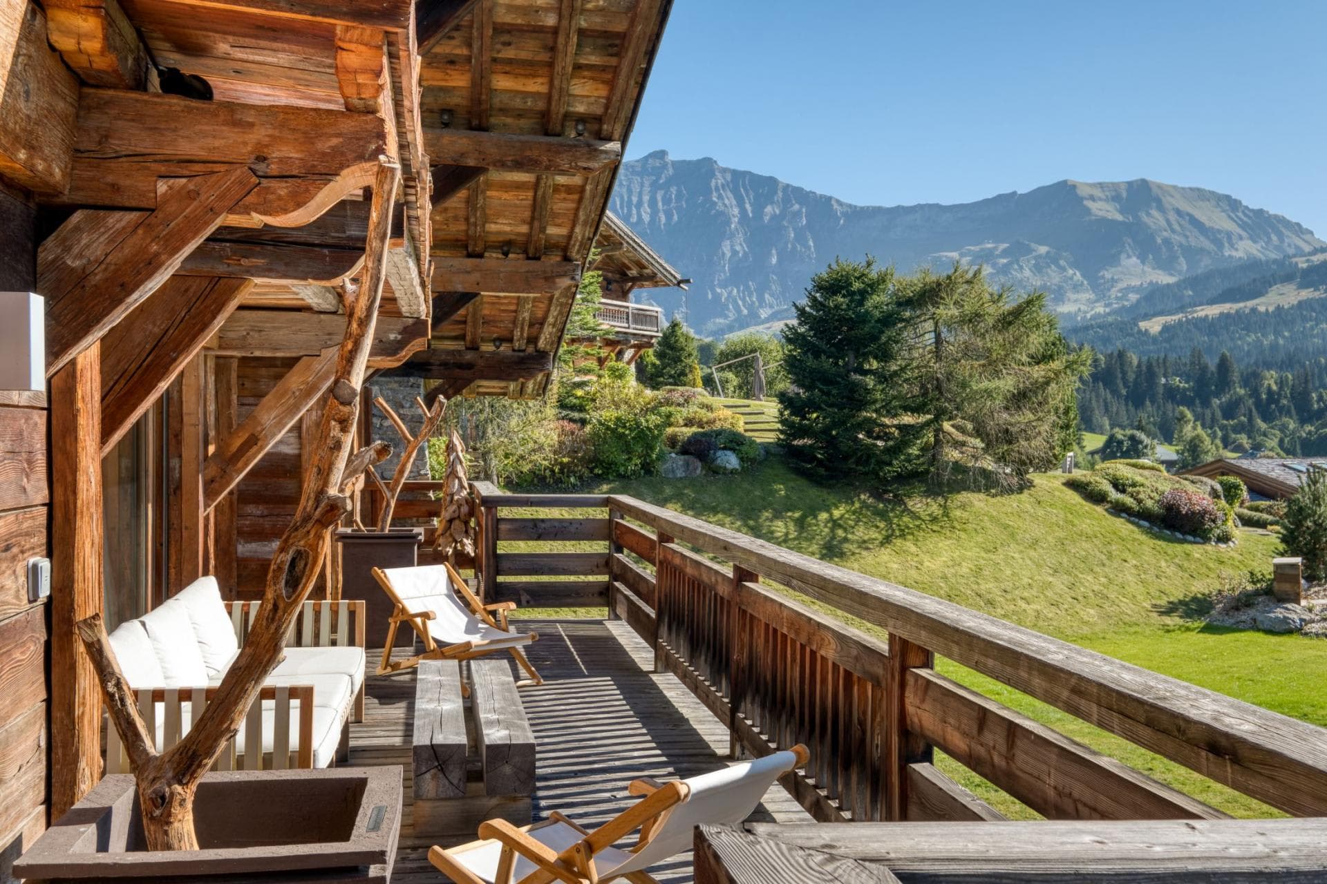 Private balcony with lounge seating and panoramic mountain views