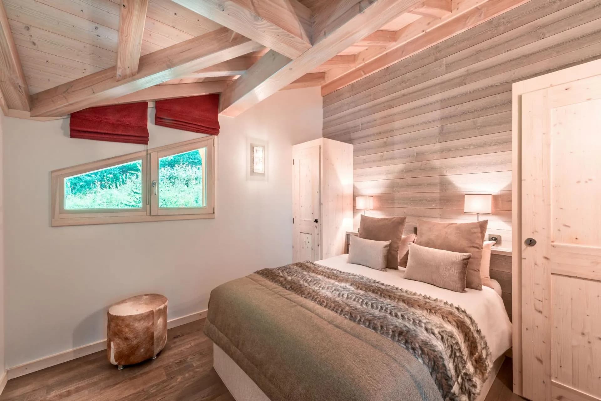King bedroom with vaulted timber ceiling