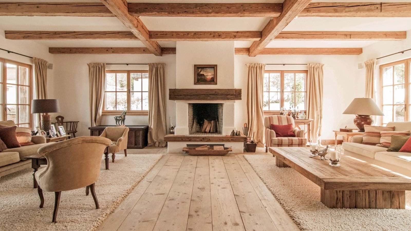 Living area with wood-burning fireplace and original timber-beamed ceilings