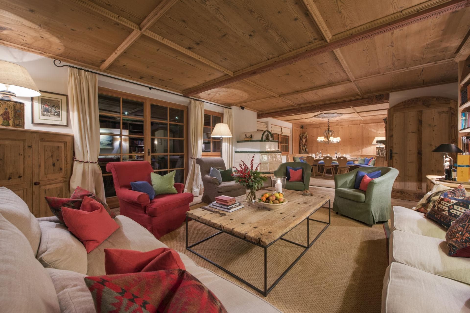 Living area with wood-paneled ceilings and terrace access; adjoining dining space