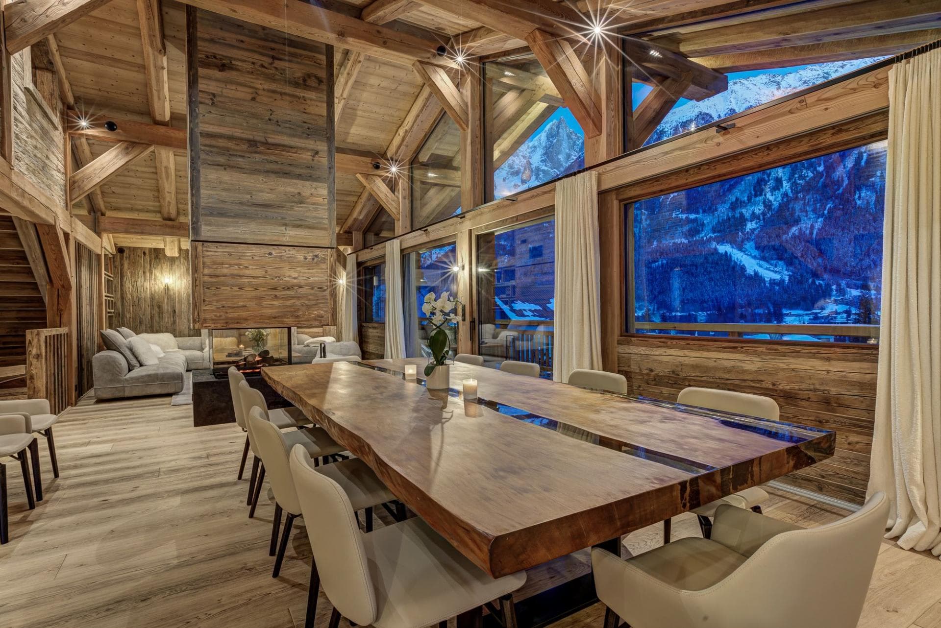 Dining area seats 12; floor-to-ceiling mountain views