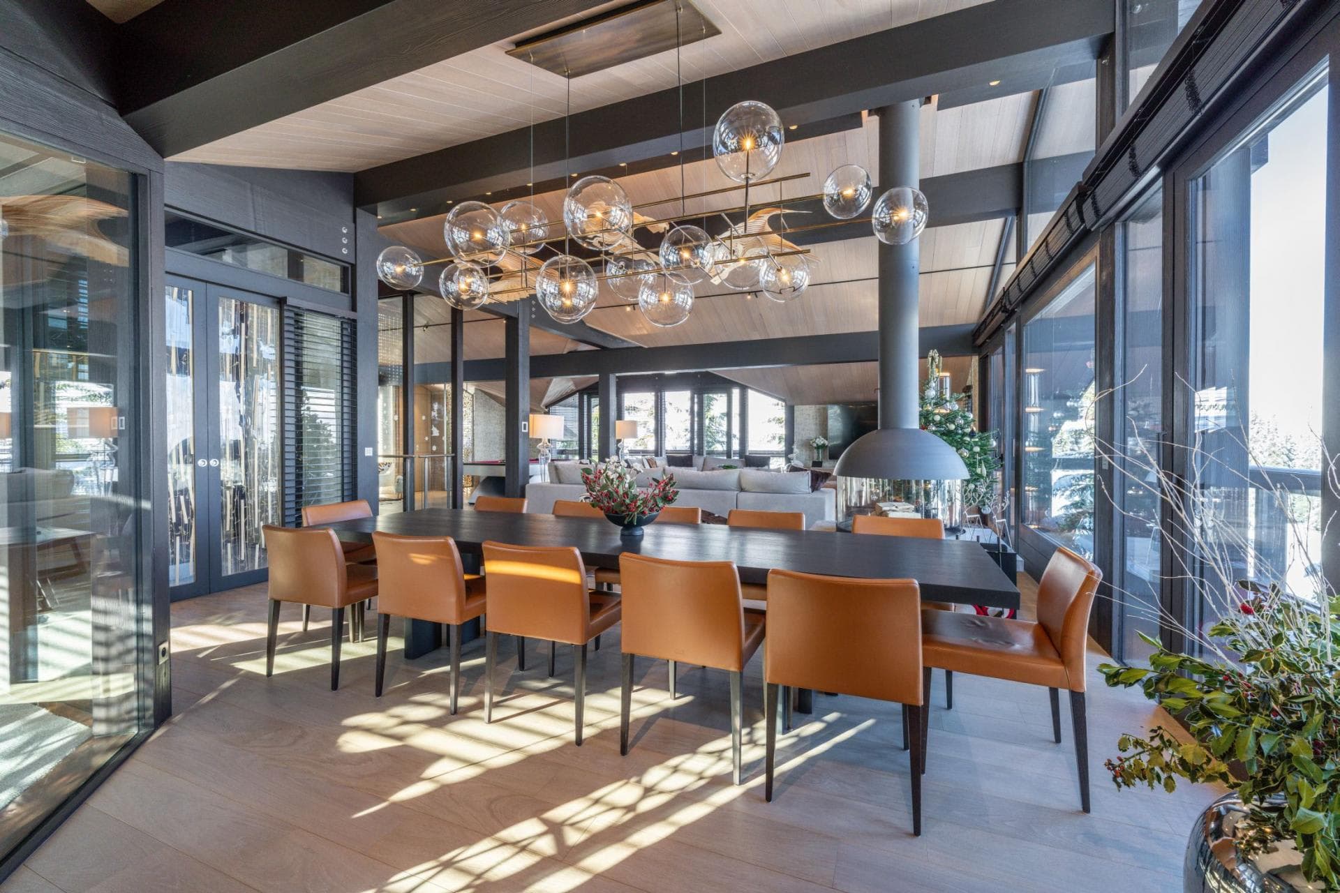 Dining area with seating for 10 and central 360-degree fireplace