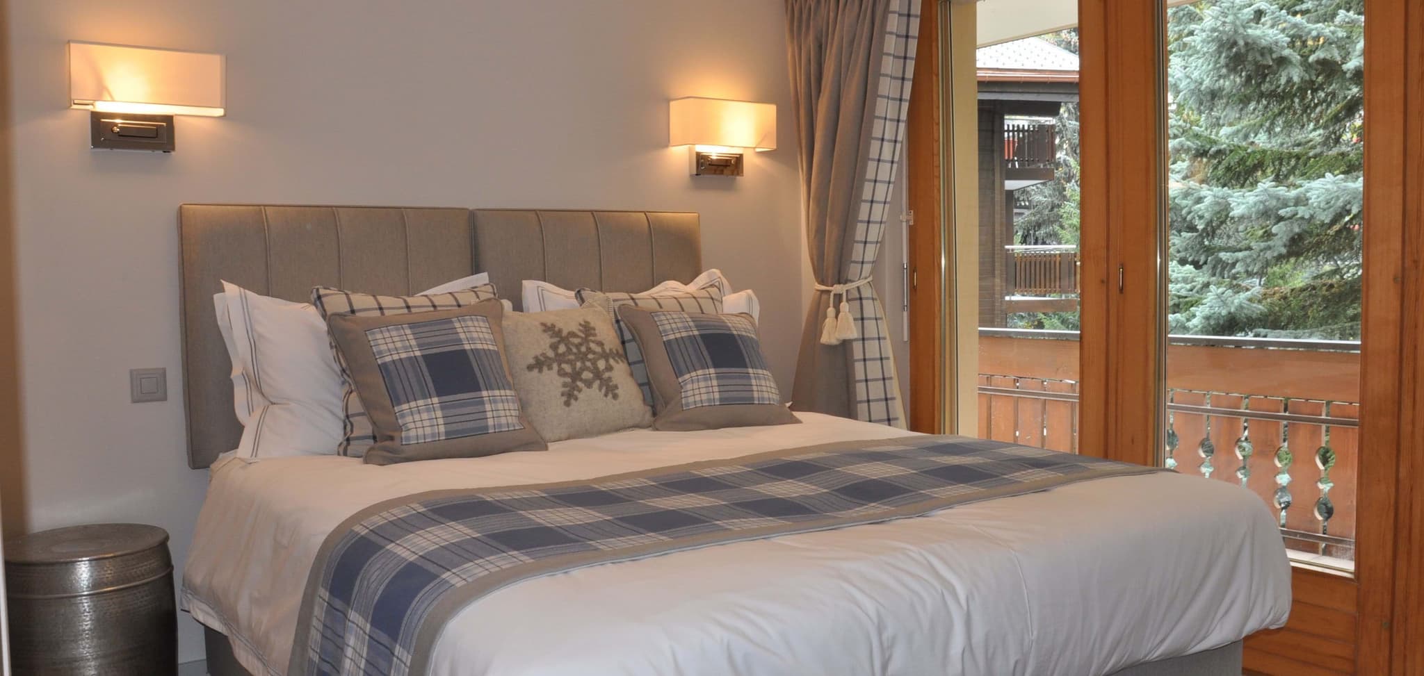 Guest bedroom with king bed and private balcony access