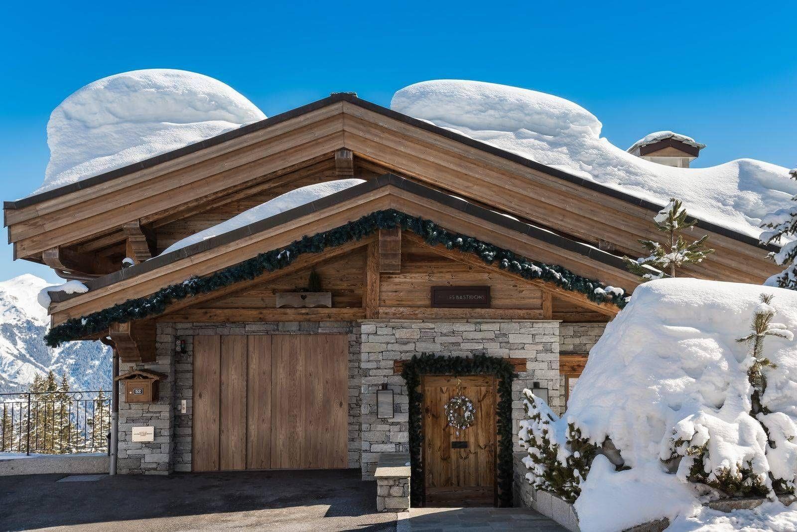 Chalet entrance and heated driveway with private garage access