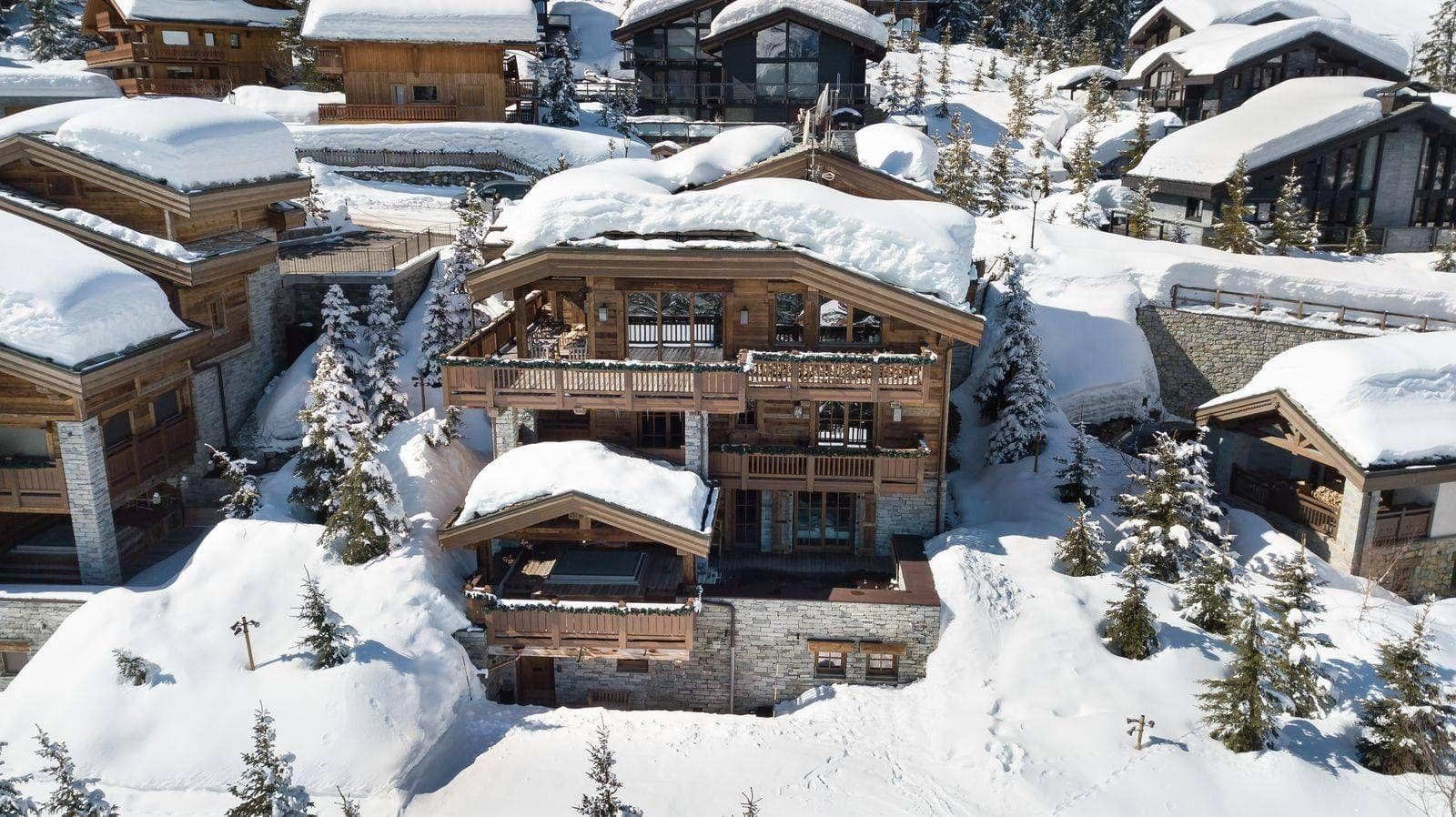 Ski-in, ski-out timber chalet with private hot tub on lower deck