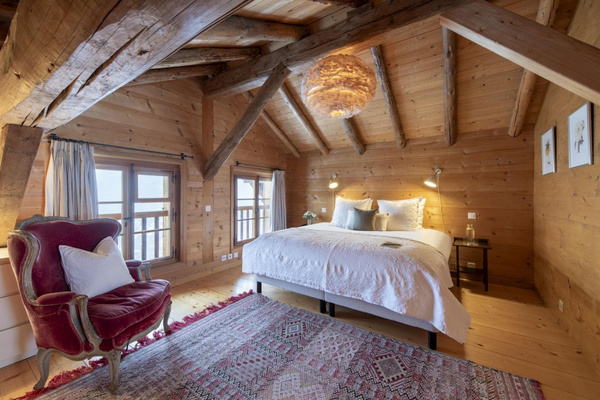 Attic bedroom with king bed and exposed timber beams