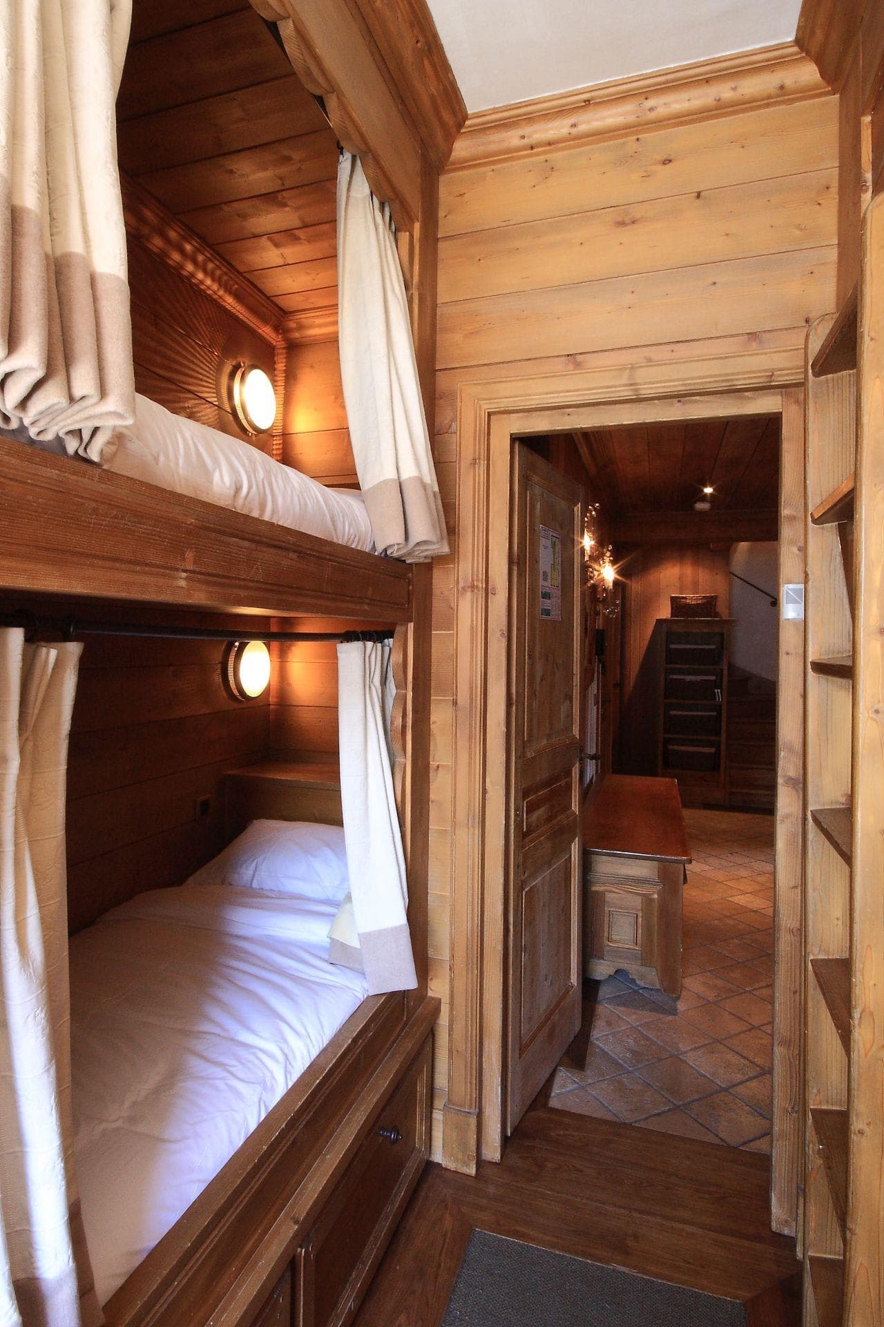 Bunk beds with privacy curtains and individual reading lights