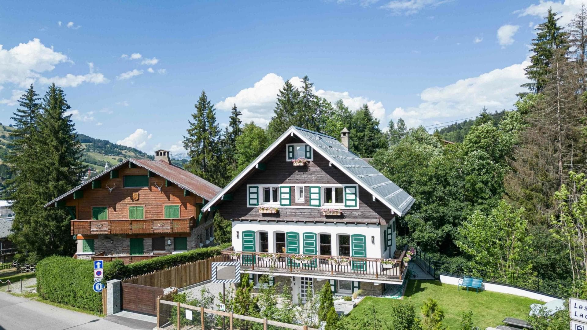 Chalet exterior with gated driveway and private garden area