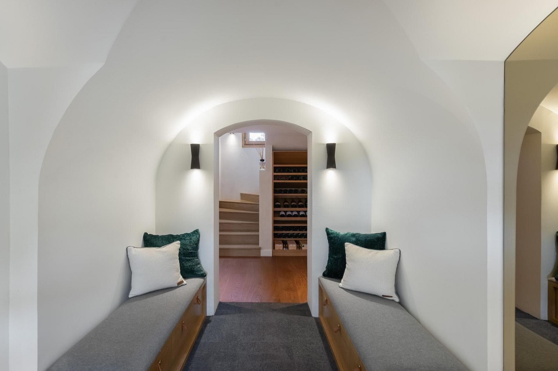 Lower level nook with bench seating and wine cellar storage