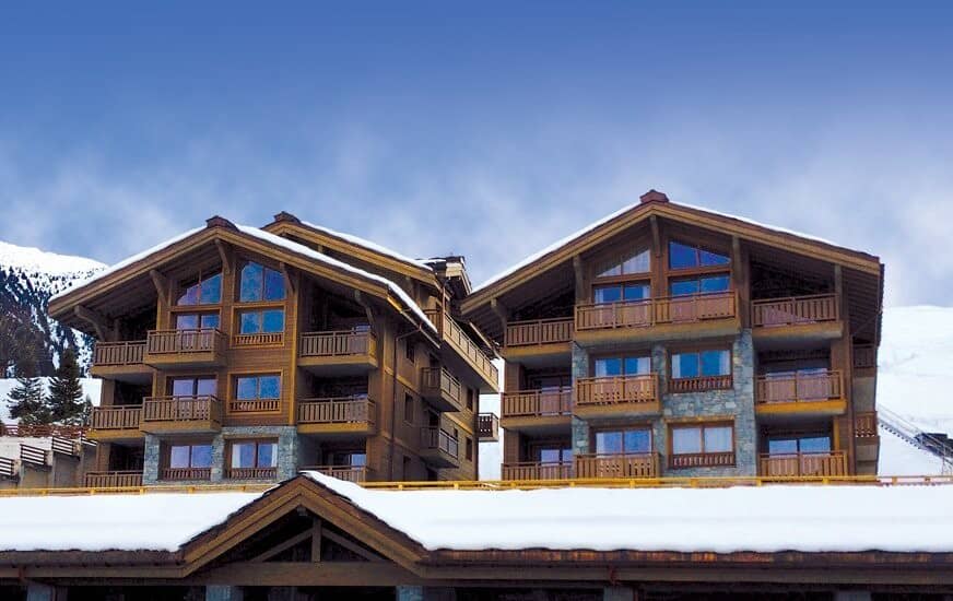 Ski-in/ski-out timber chalets with private balconies and mountain views
