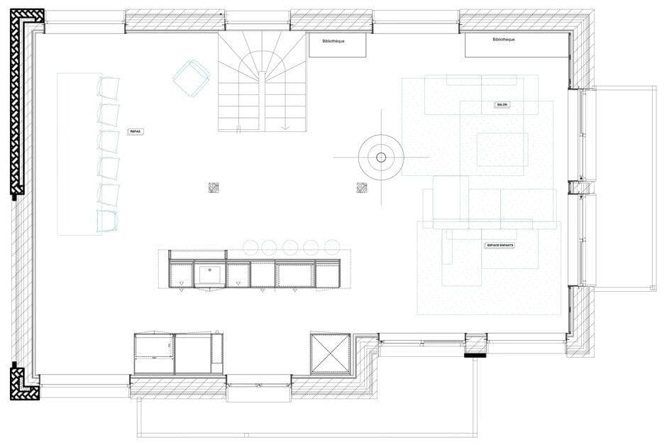 Open-plan main floor: living area, kitchen island, and dining seating for eight