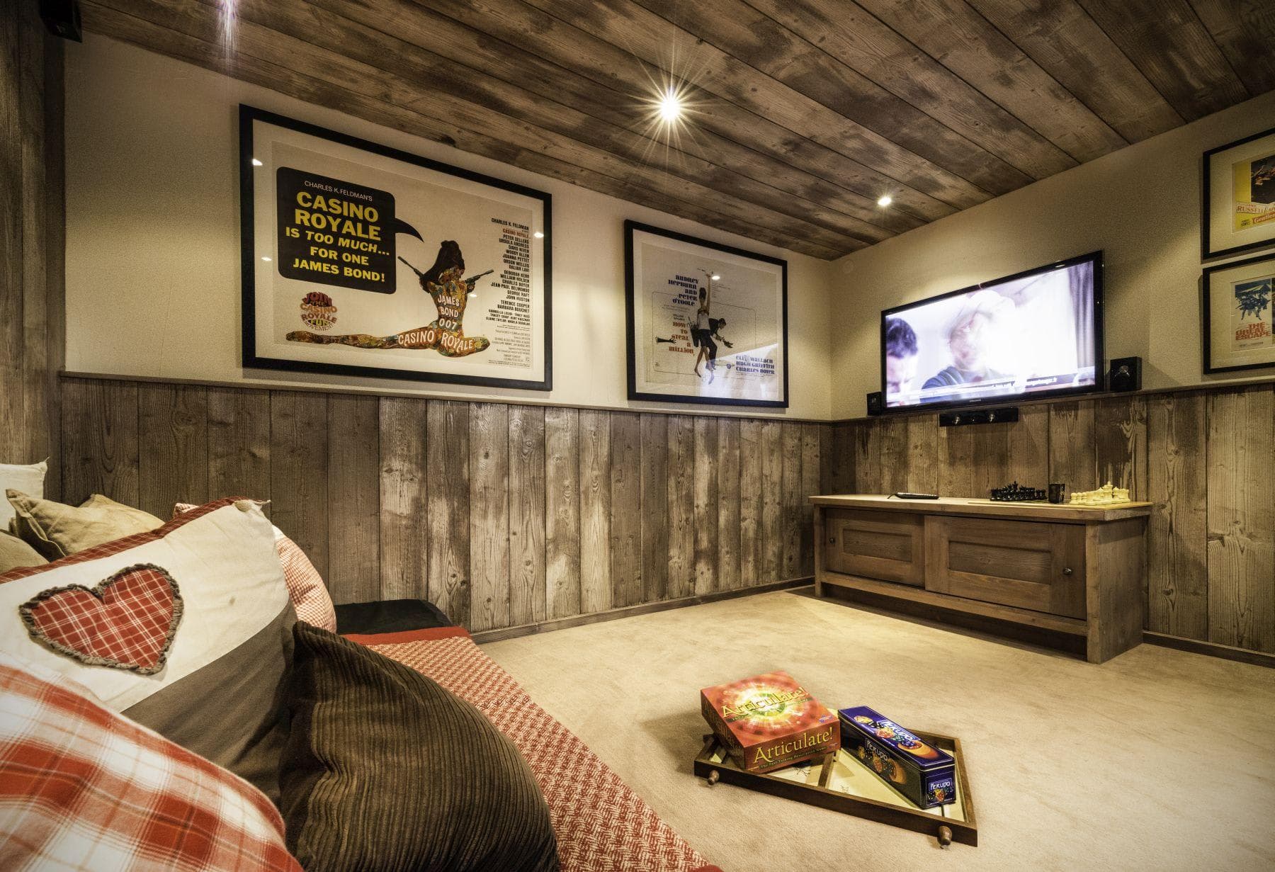 Media room with wall-mounted TV and integrated sound system