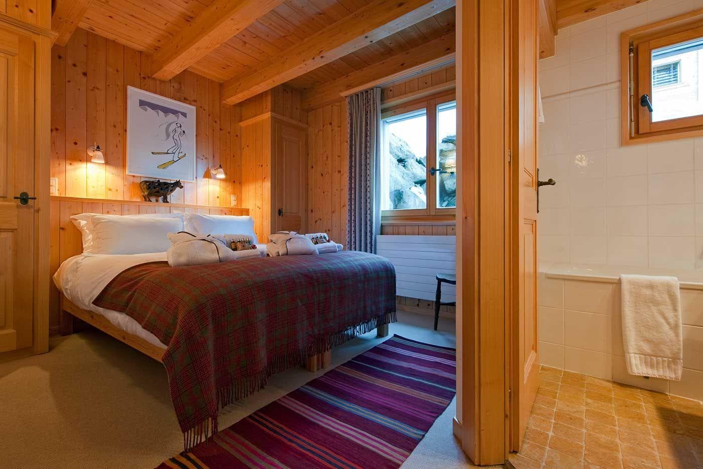 Guest bedroom with queen bed and en-suite bathroom with soaking tub