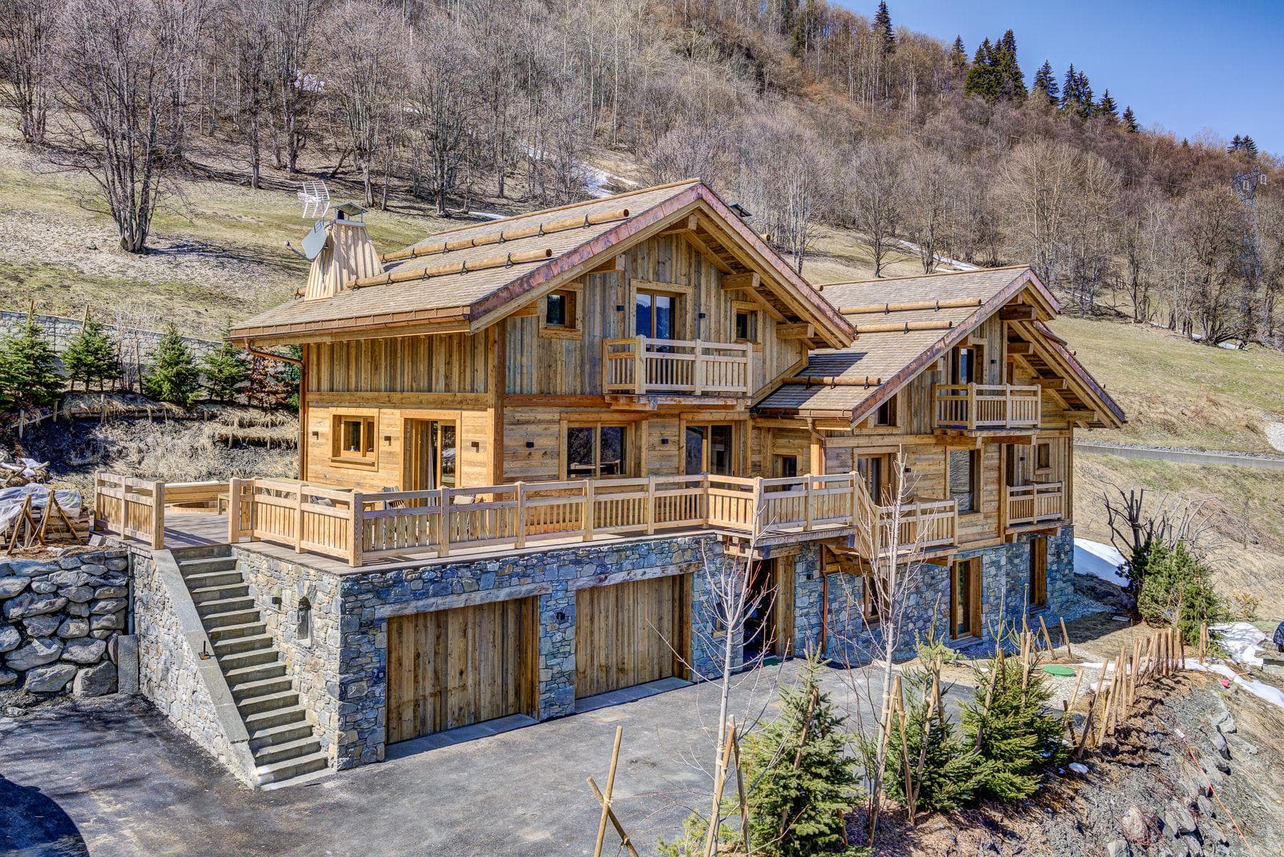 Multi-level chalet with two-car garage and wrap-around terrace
