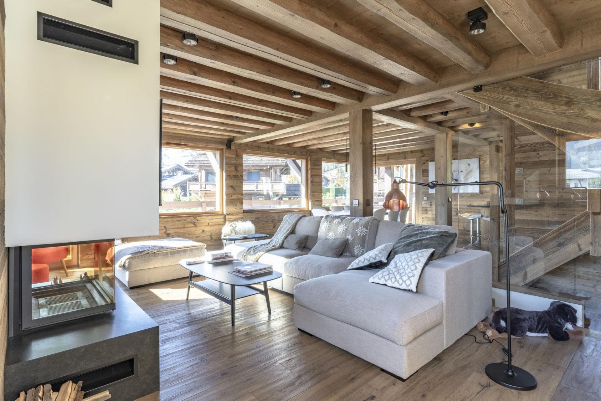 Living area with wood-burning fireplace and sectional seating for six