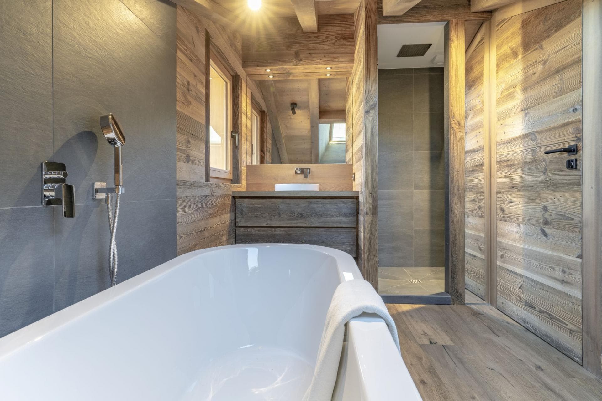Bathroom with soaking tub and separate walk-in rainfall shower