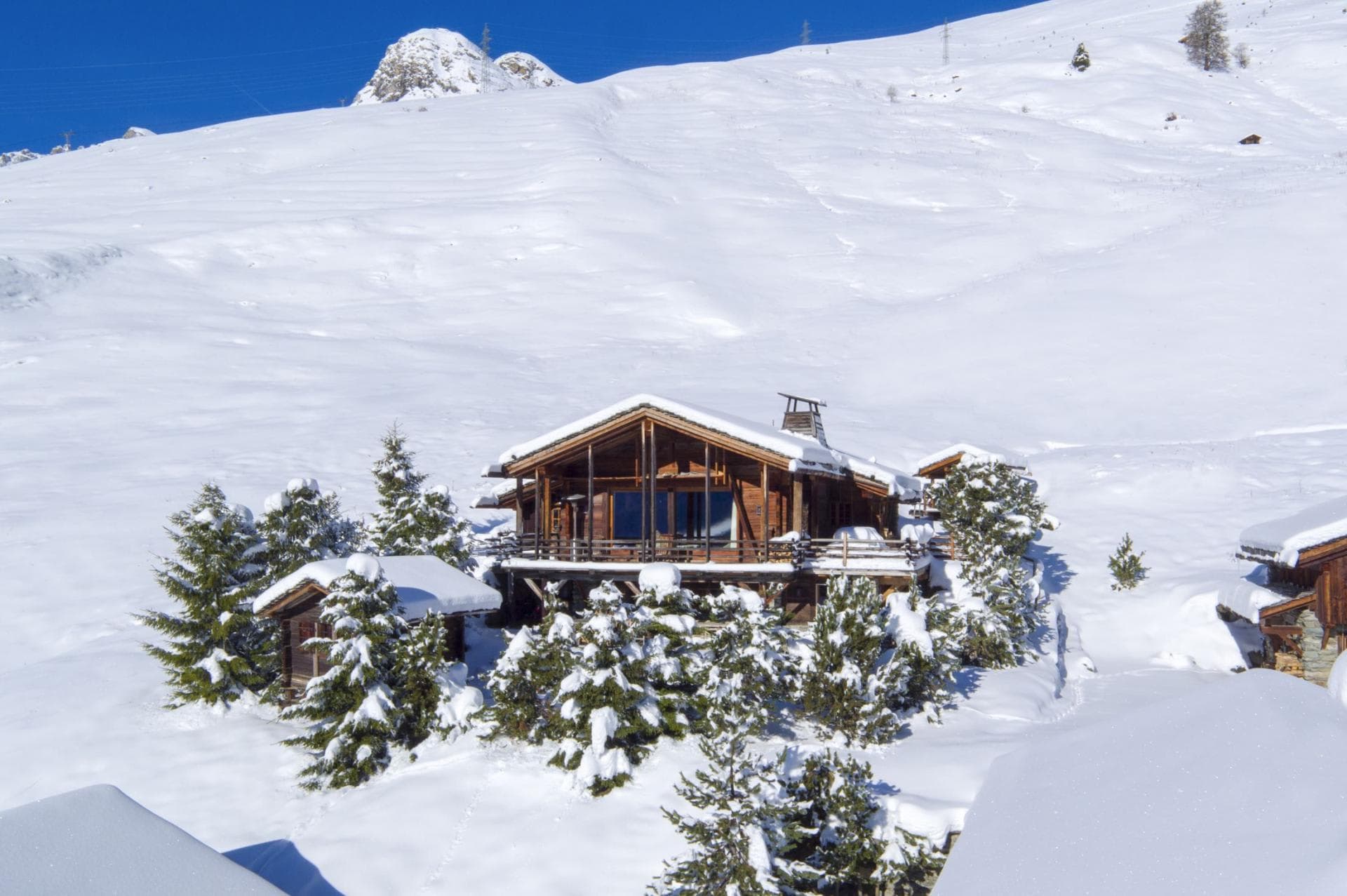 Ski-in, ski-out timber chalet with wrap-around deck and mountain views