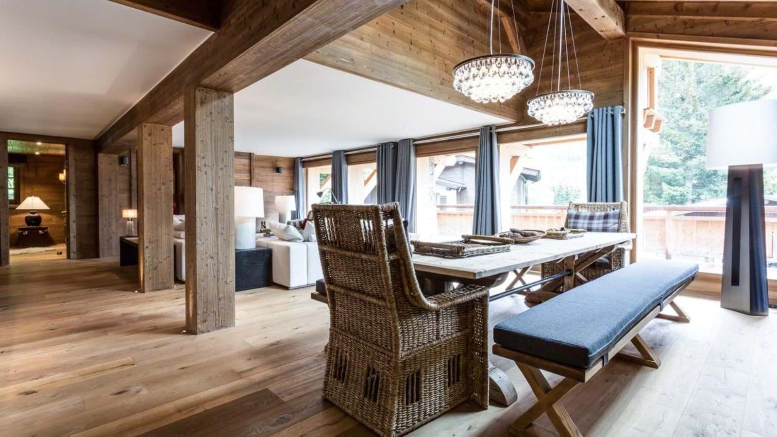 Dining area with bench seating and floor-to-ceiling windows; seats 8