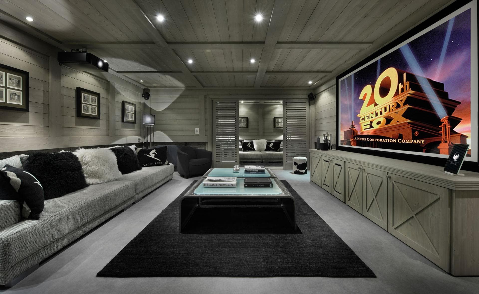 Cinema room with large projector screen and seating for 8