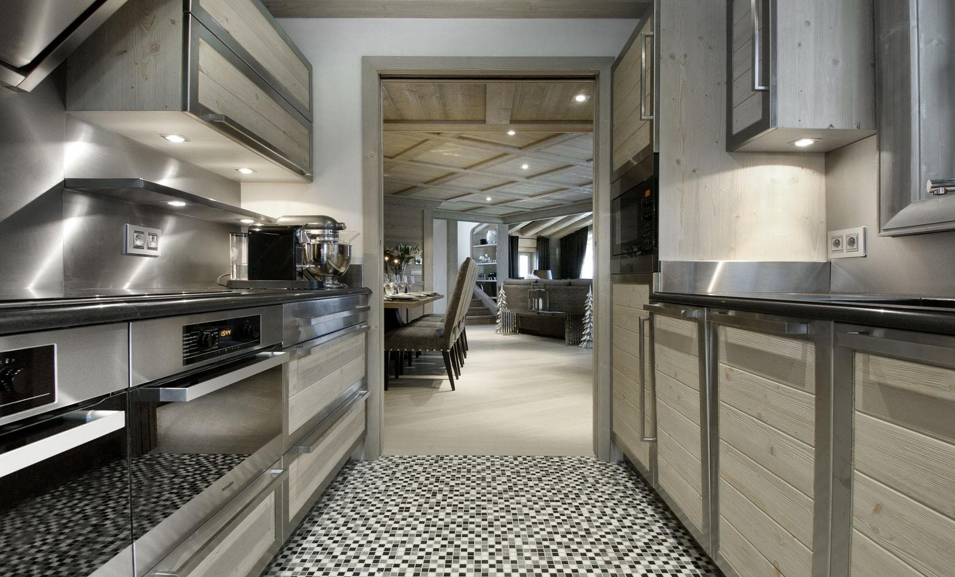 Kitchen with Miele oven and stand mixer; opens to dining area