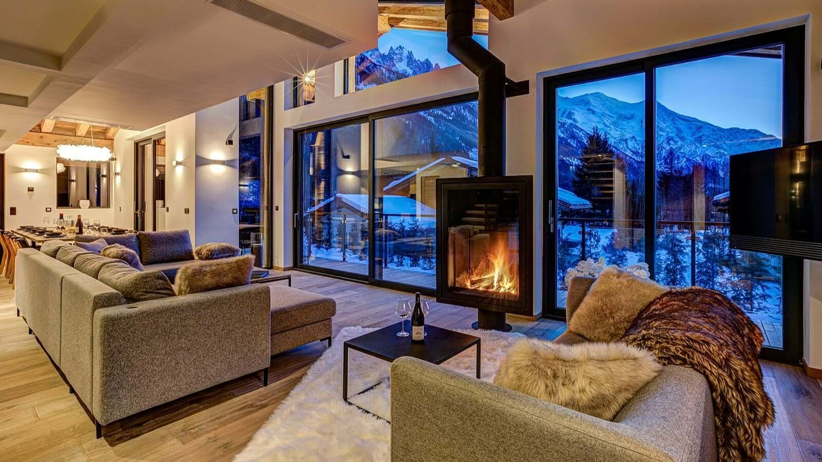 Open-plan living area with wood-burning fireplace and Mont Blanc views