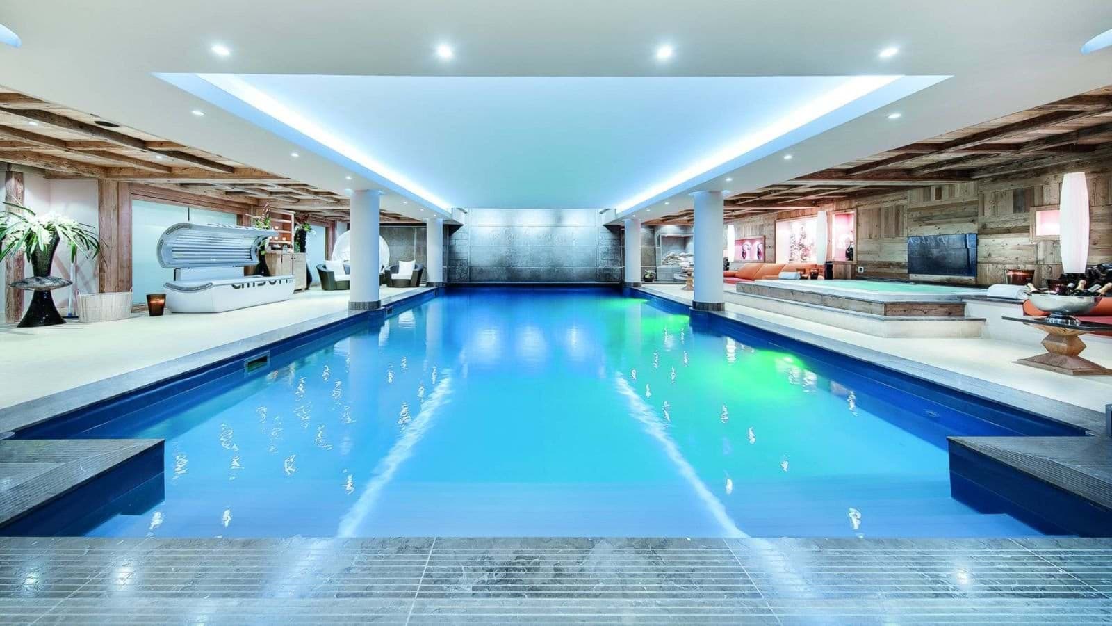 Indoor lap pool with lane markings; heated, skylight ceiling