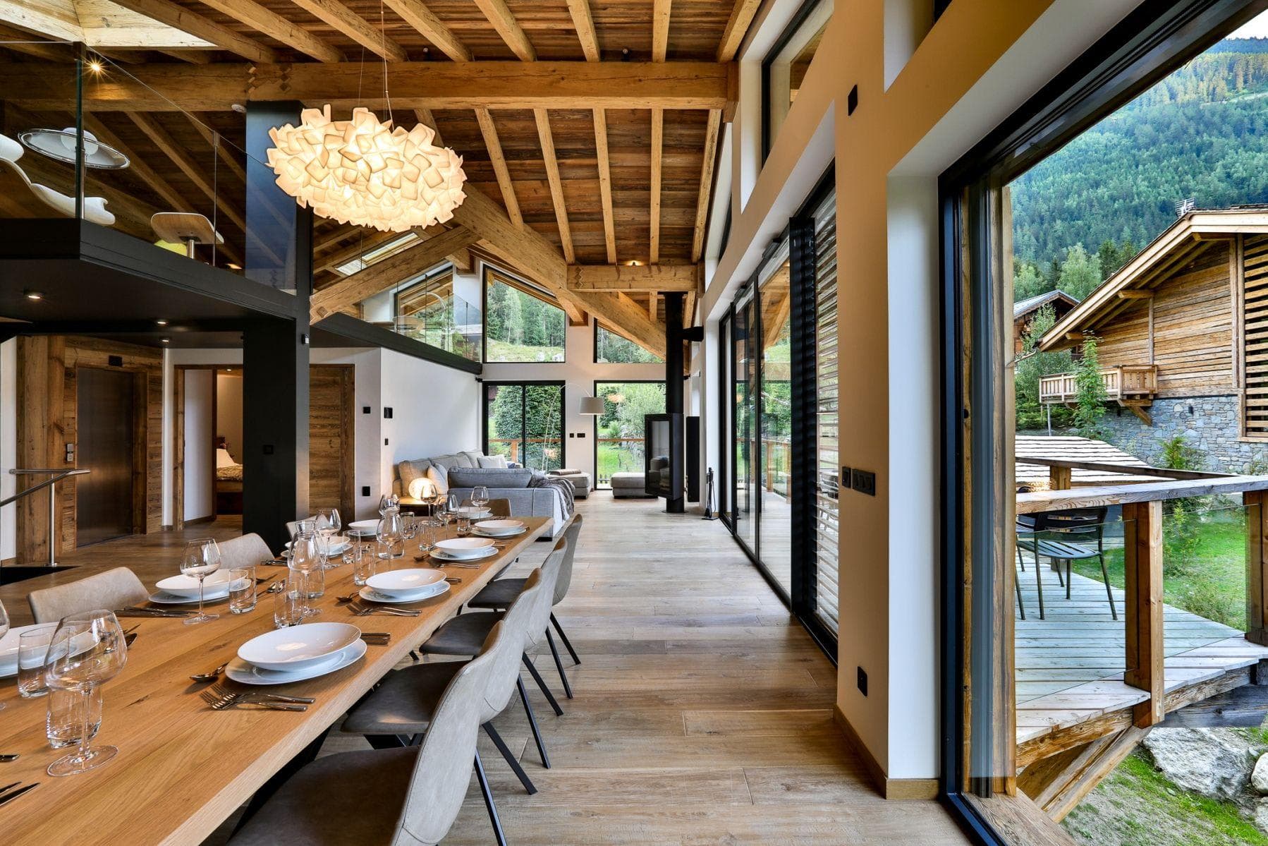 Open-plan dining area with seating for 10 and balcony access