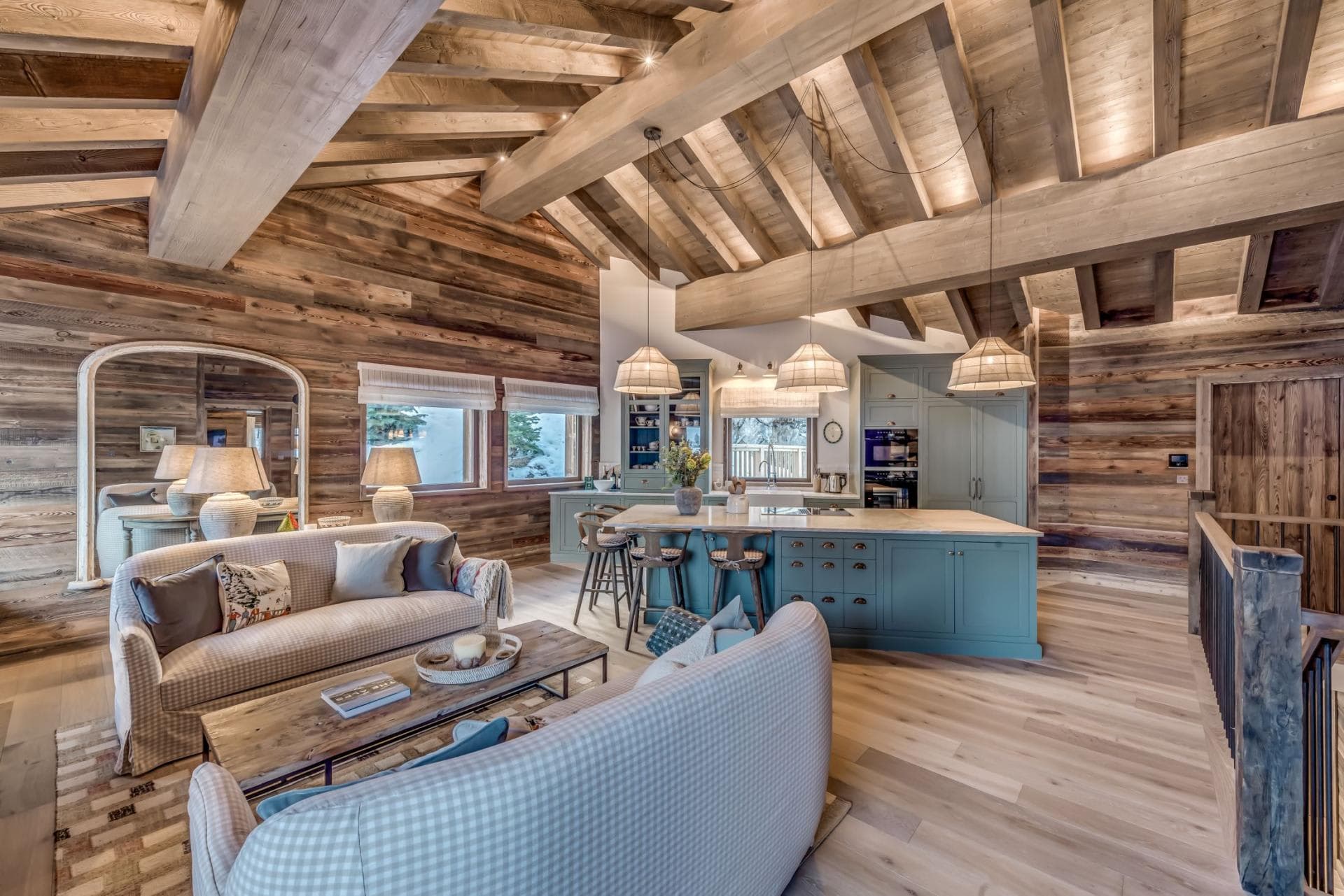 Open-plan living area and kitchen with vaulted timber ceilings