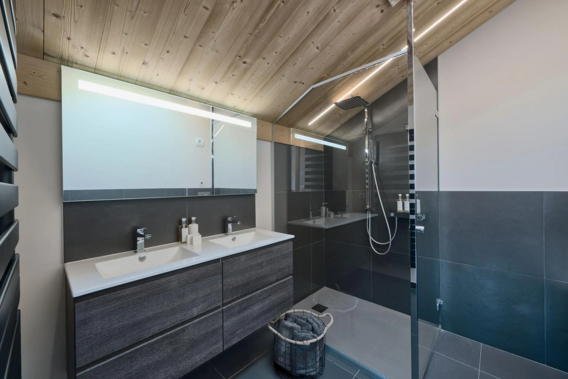 Bathroom with dual vanity and walk-in rainfall shower