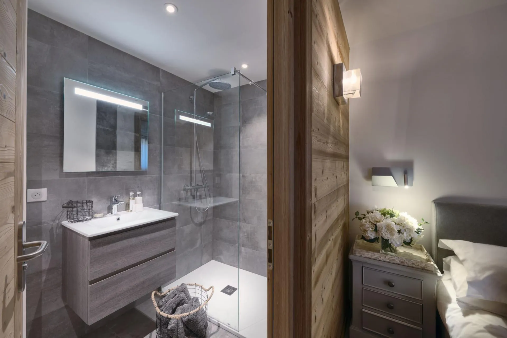 Ensuite bathroom with walk-in shower and backlit mirror