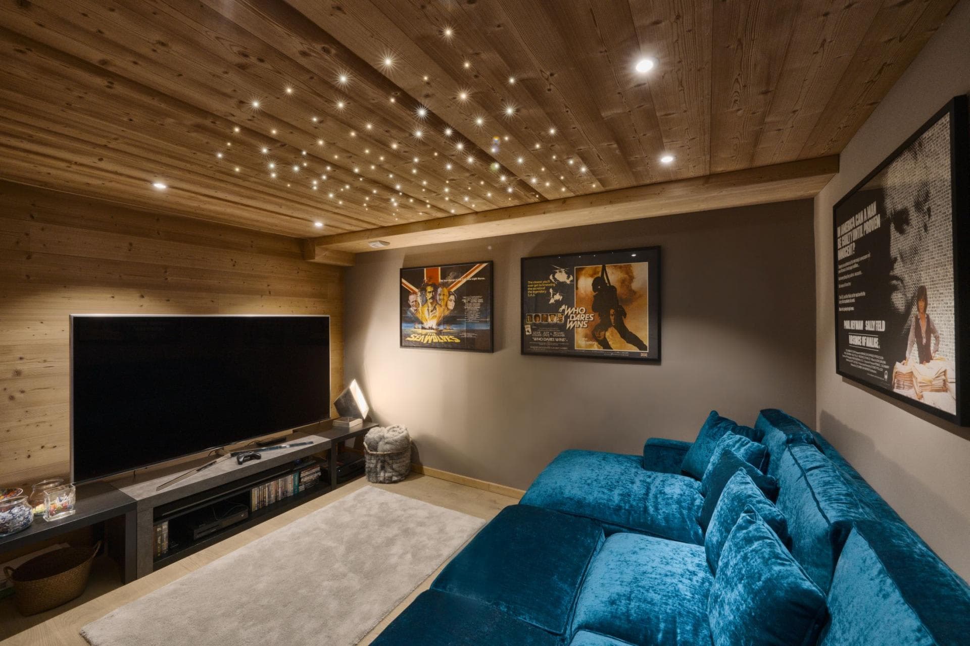 Media room with velvet sectional and starlight ceiling