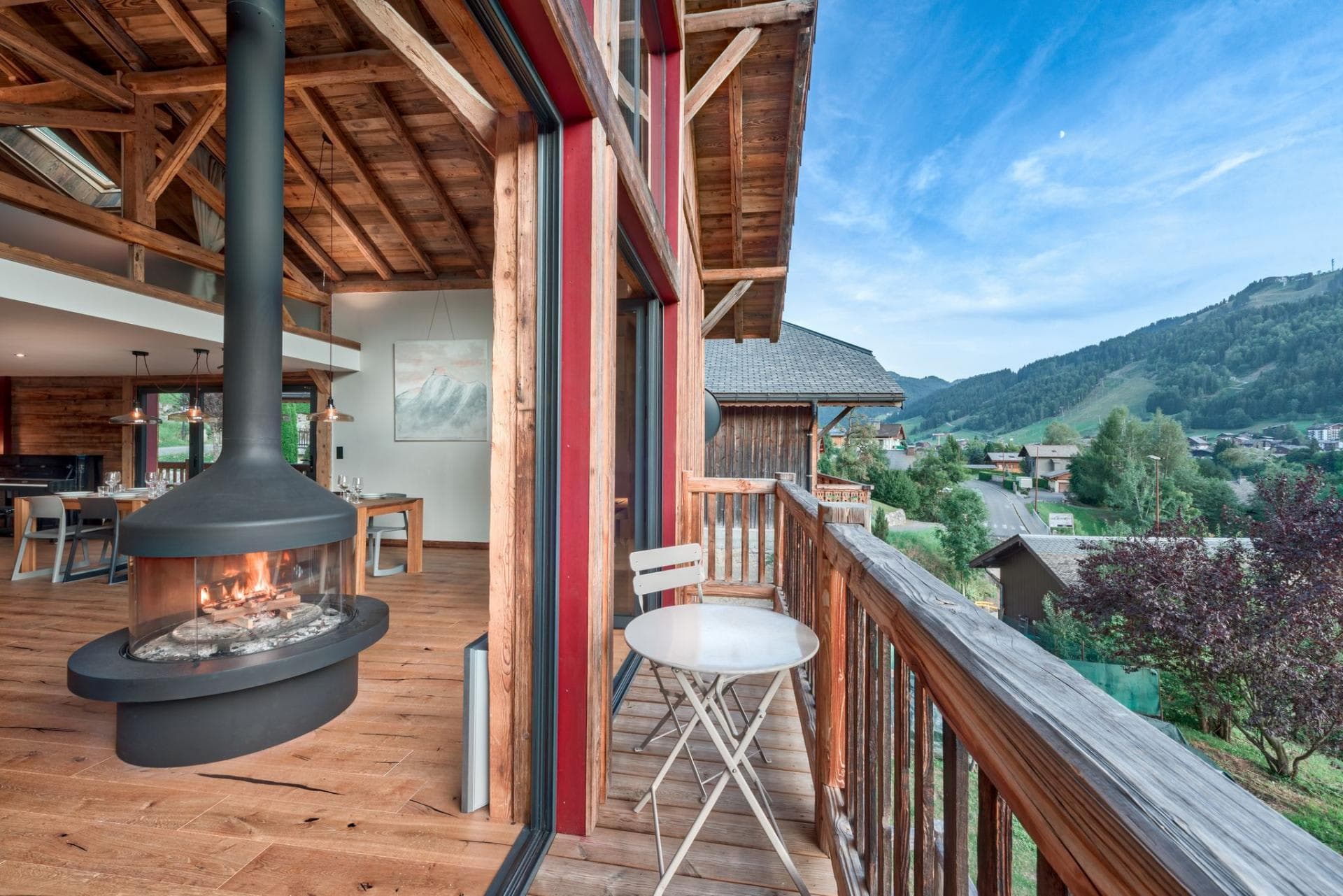 Private balcony with valley views and 360-degree indoor wood fireplace