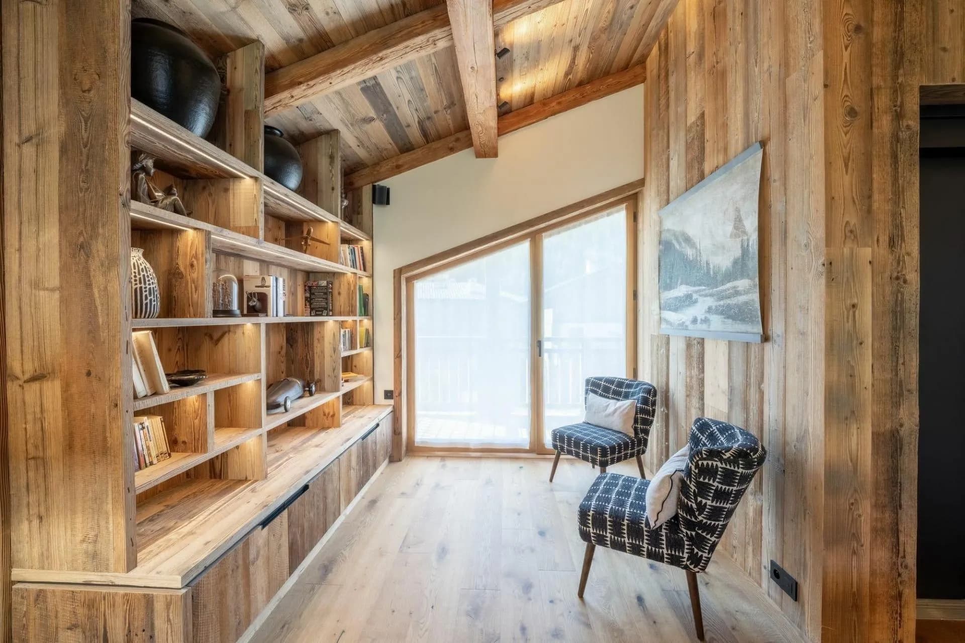 Reading nook with built-in bookshelves and picture window