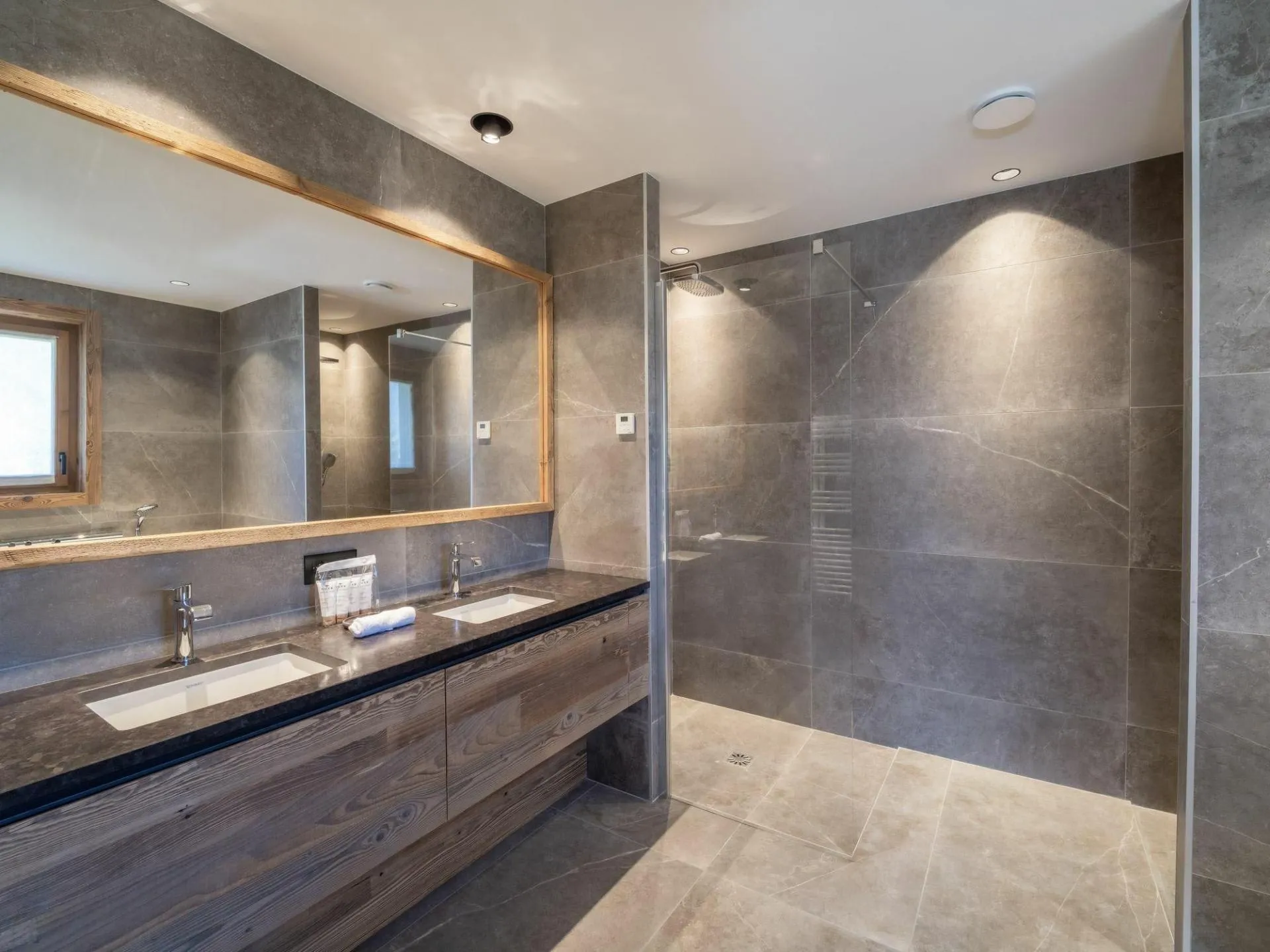 Bathroom with double vanity and shower