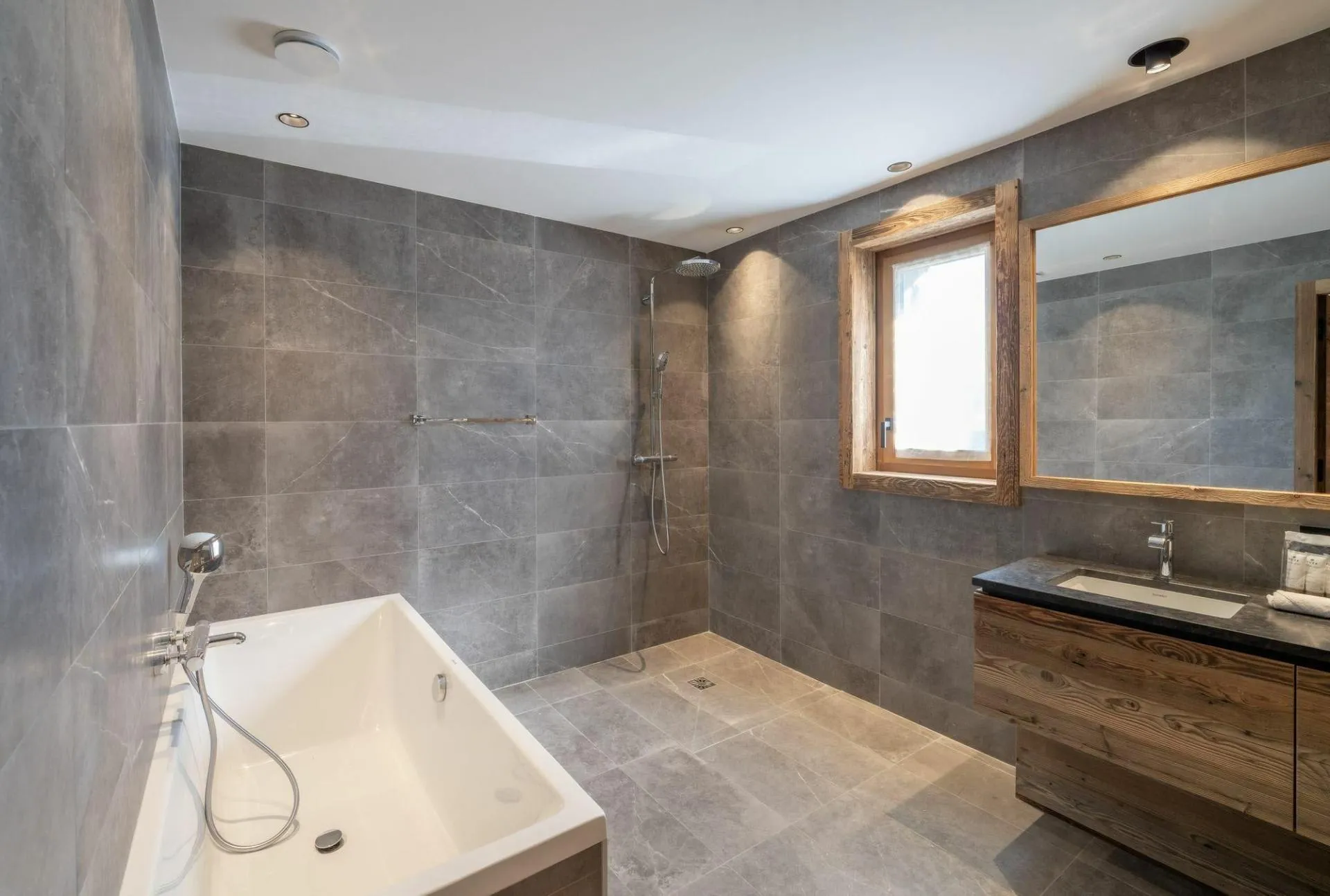 Bathroom with bathtub and double vanity