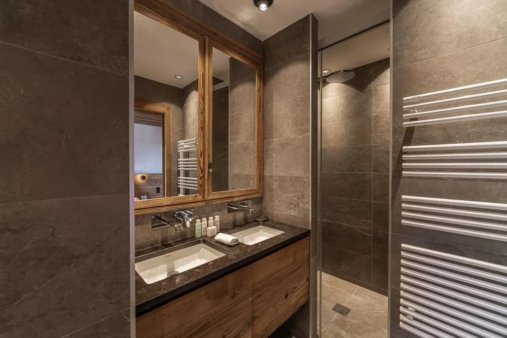 Bathroom with twin basins and heated towel rail