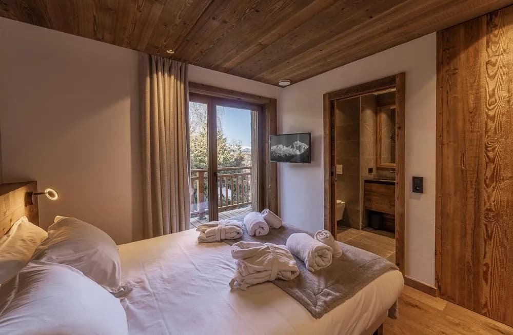 Double bedroom with balcony doors and ensuite shower room