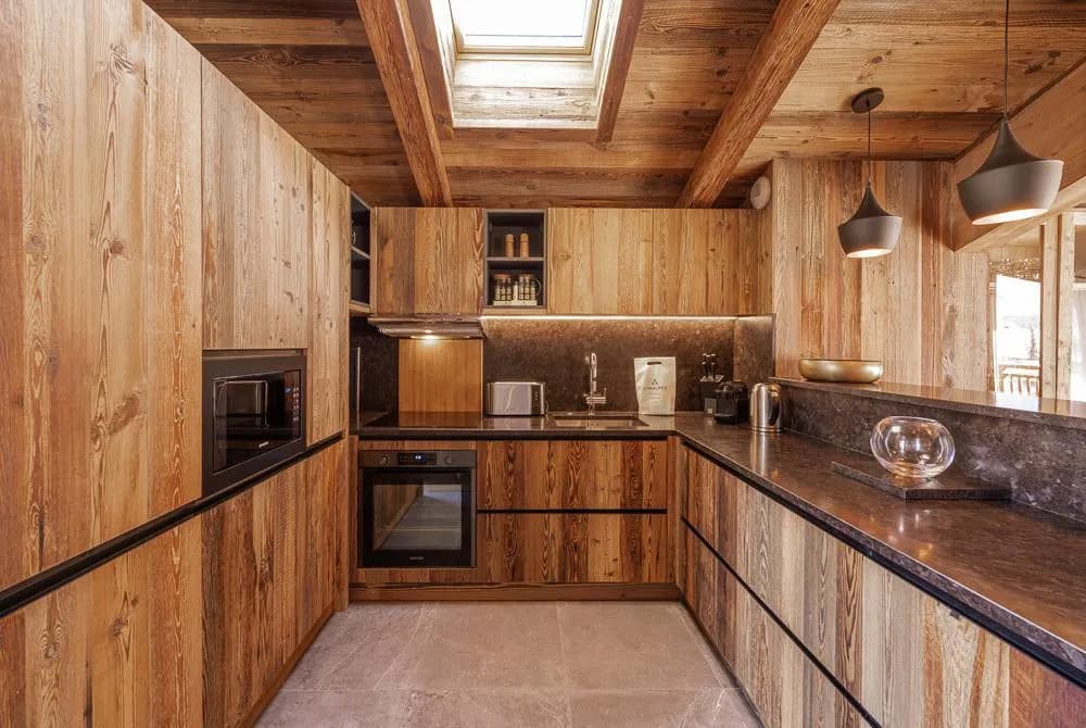 Fitted kitchen with timber cabinetry and skylight