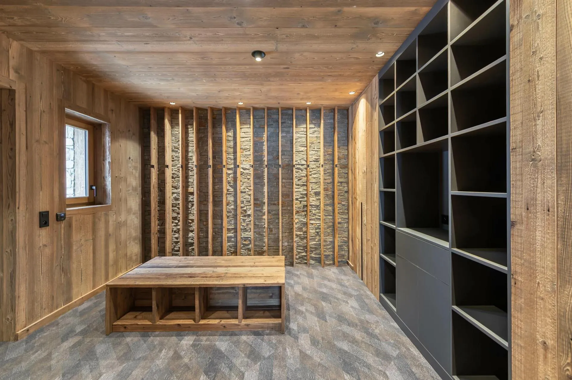 Ski boot room with built-in shelving and heated drying racks