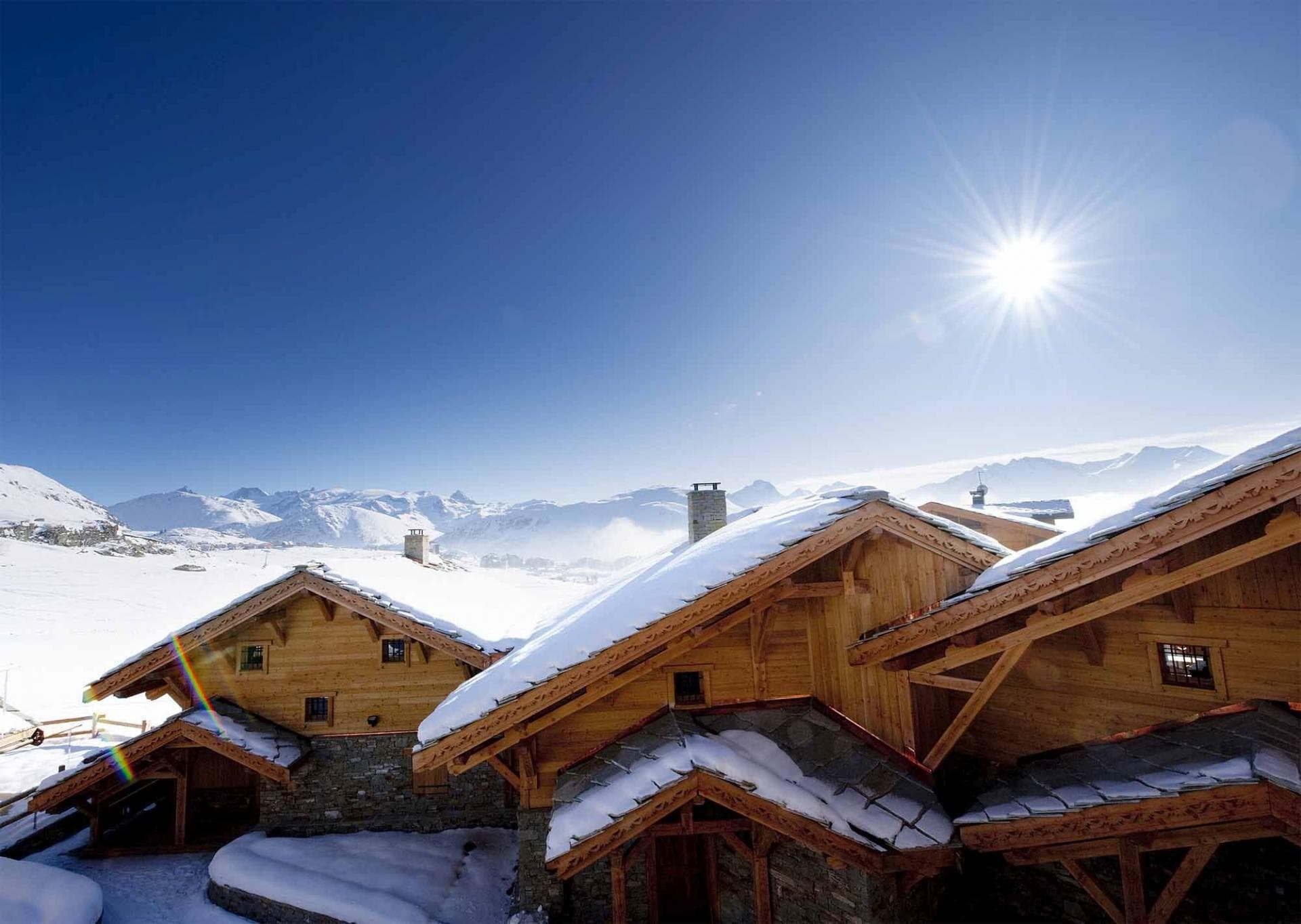 Ski-in/ski-out chalet exterior with south-facing mountain views