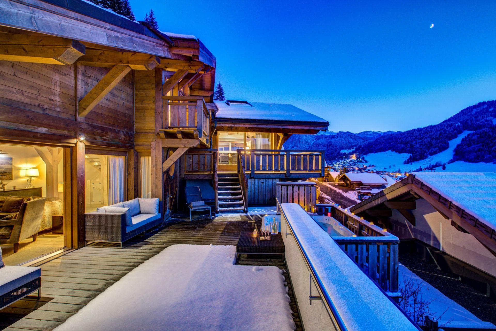 Multi-level timber deck with hot tub and mountain valley views