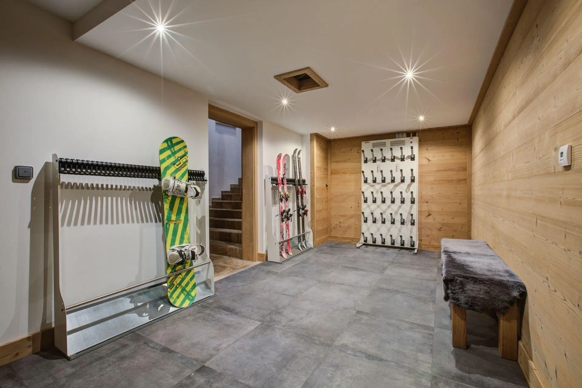 Boot room with heated boot racks and ski storage