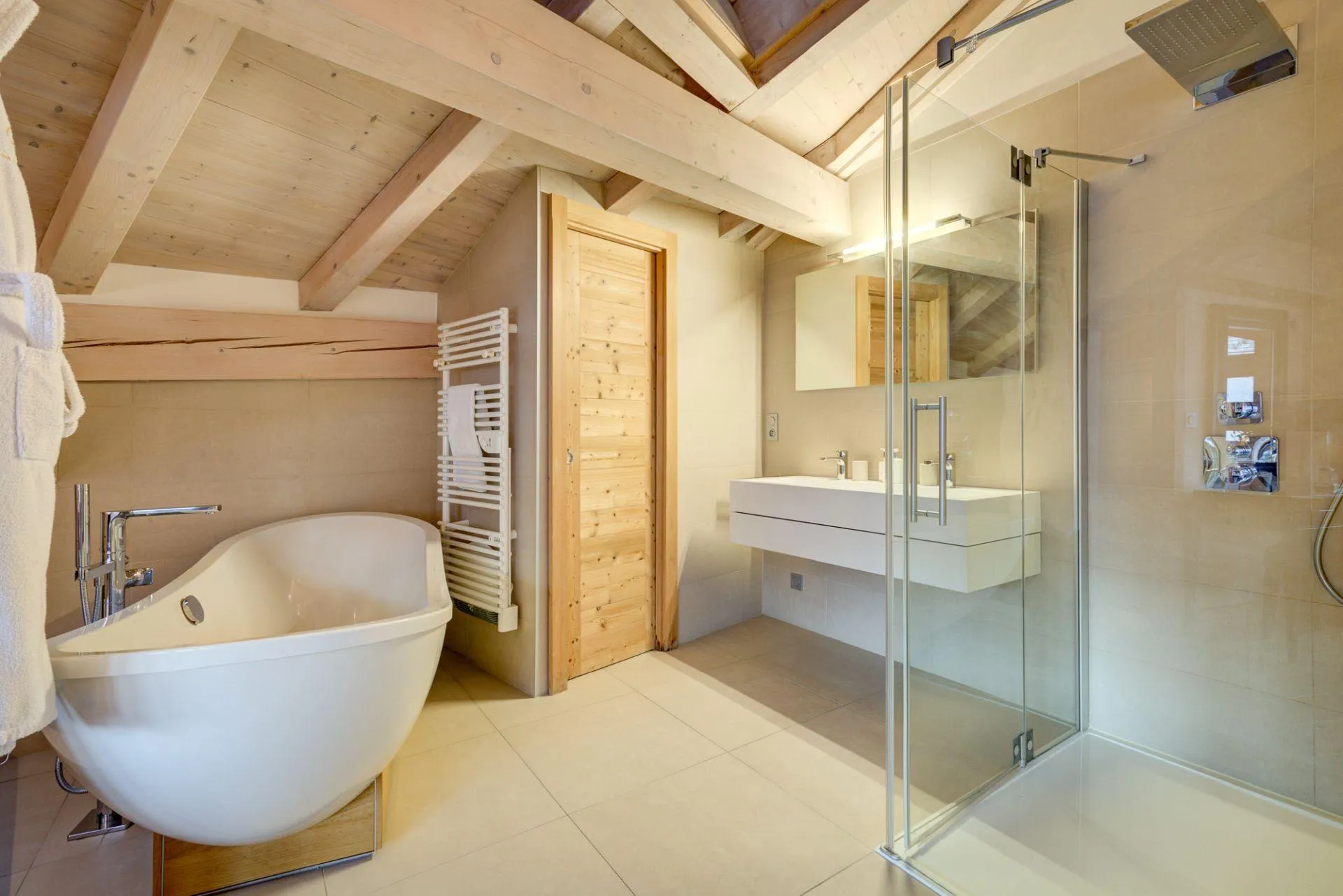 Bathroom with freestanding bath, walk-in shower and heated towel rail