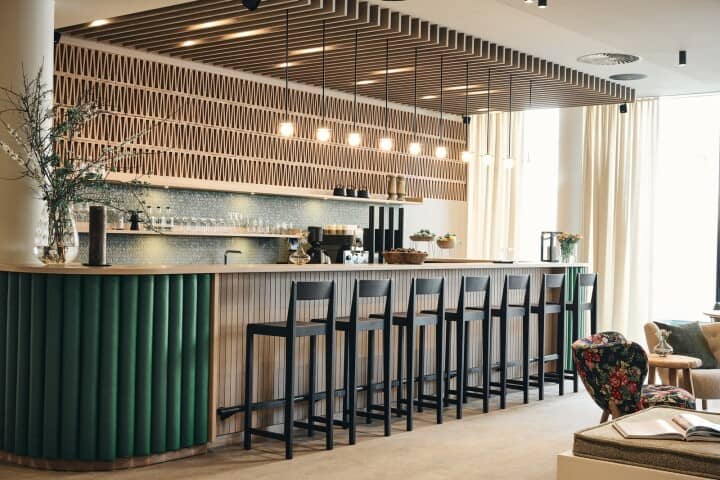 Coffee bar and kitchenette with island seating for 7