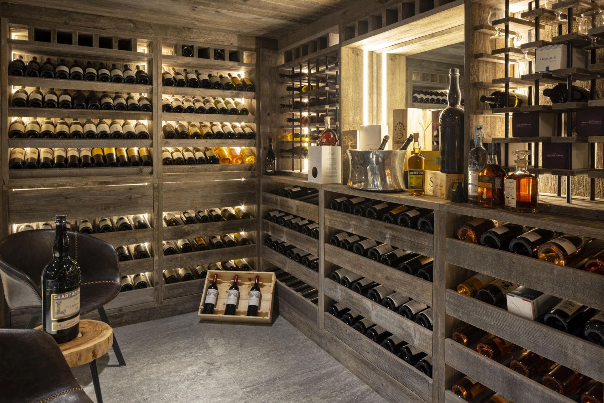 Temperature-controlled wine cellar with reclaimed wood shelving and tasting area