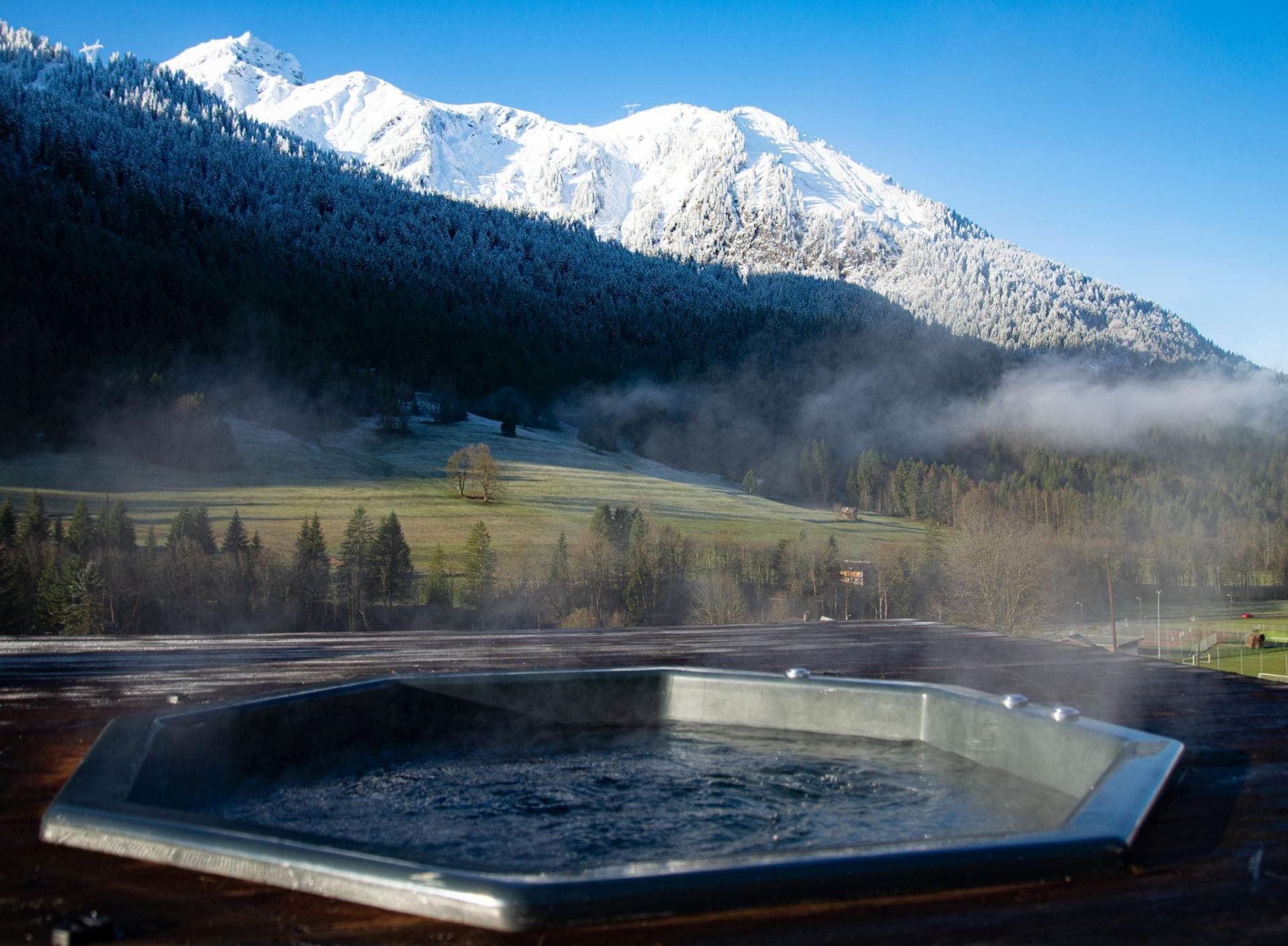 Rooftop hot tub with panoramic mountain and valley views