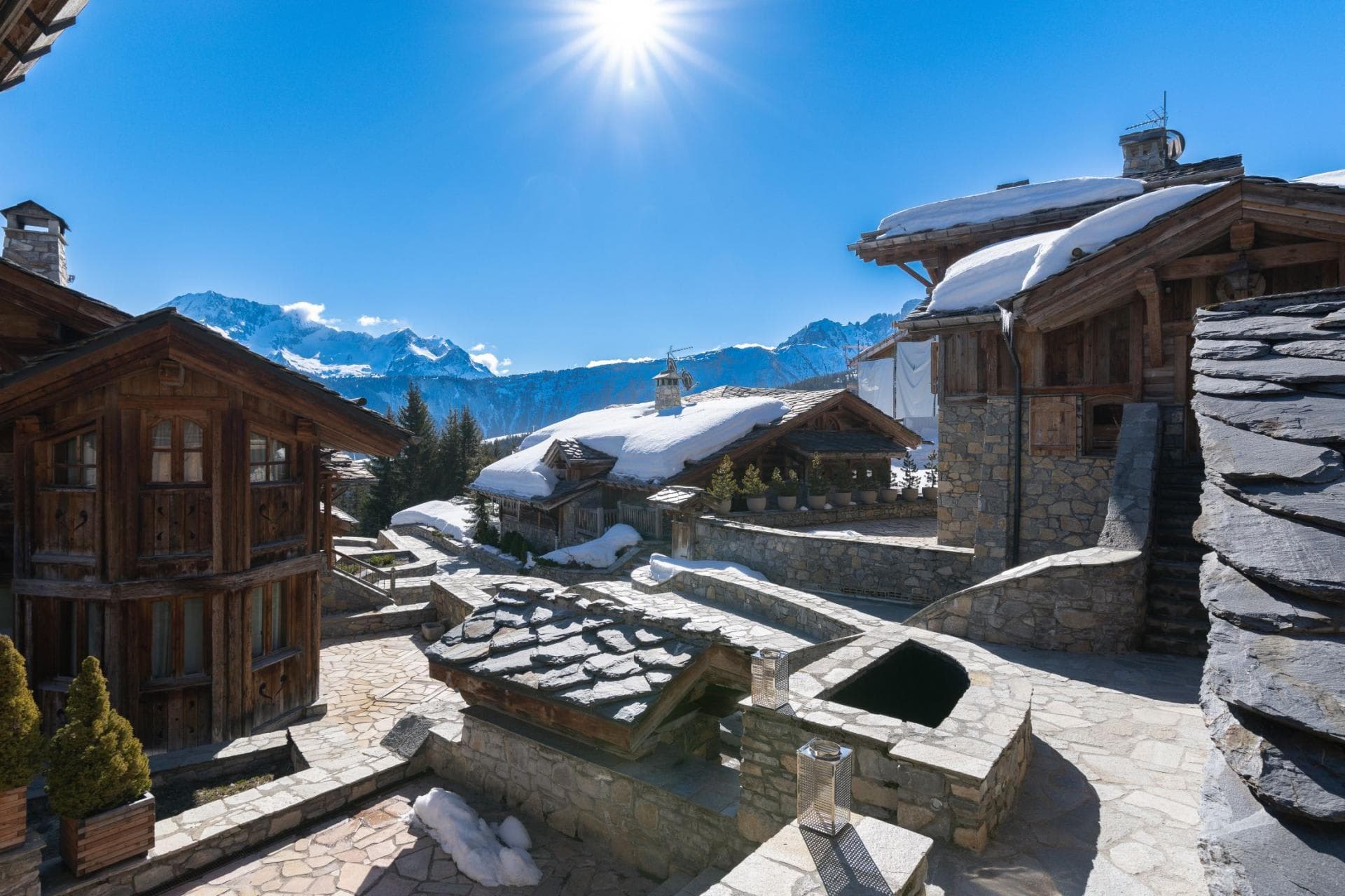Stone patio and mountain views; traditional timber and slate architecture