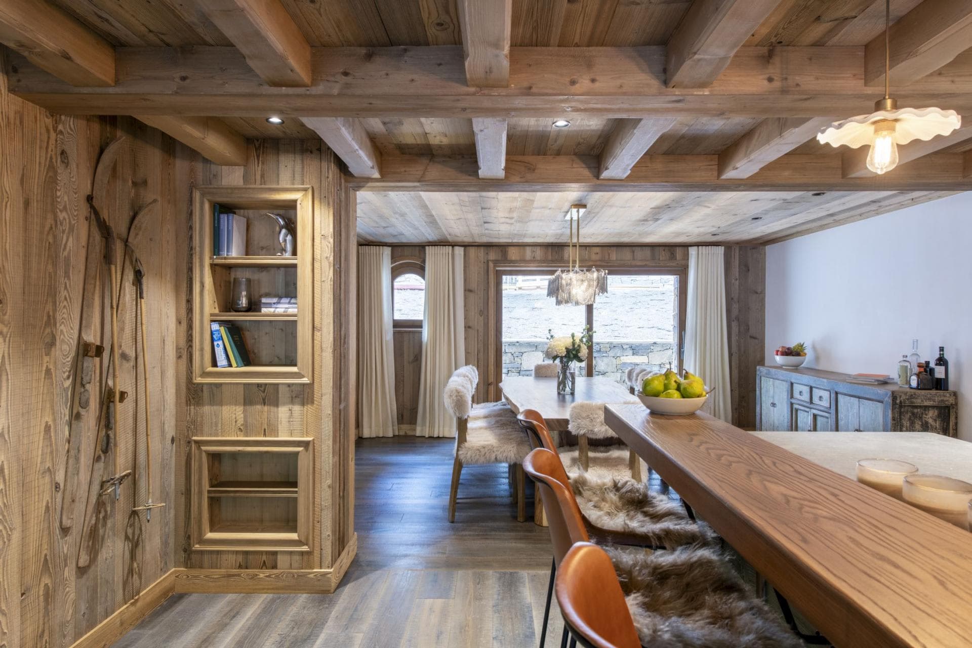 Open dining area with bar seating and vintage ski decor